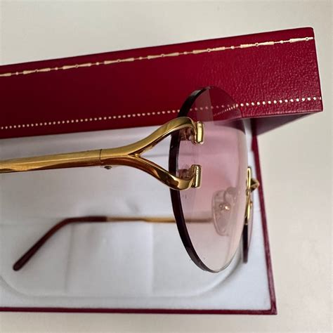 cartier c decor rimless glasses.